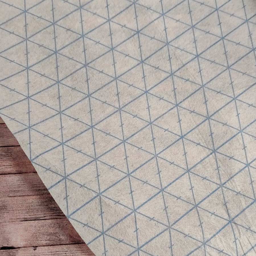 Entretela Rasterquick con cuadrícula de triángulos de 60 grados para patchwork de precisión, ancho 80 cm.